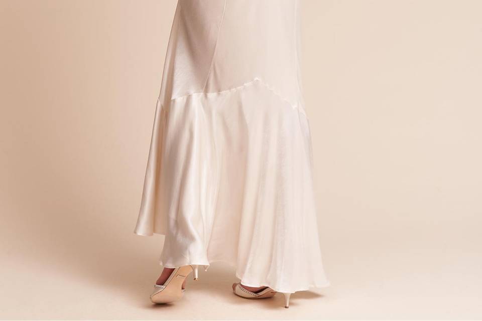 Ghost London	BHLDN Bella Dress	<br>	This sleek satin dress brings an effortless glamour with a floor-skimming silhouette, v-neck (with matching back), and godet detailing.