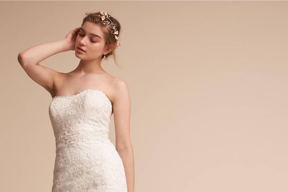 Eddy K	BHLDN Marjorie Gown	<br>	Replete with floral lace appliqué and fitted through the hips, this strapless gown flatters the décolletage with a sweetheart neckline and plunging back. Swirling, organic vines and intricate blooms extend onto the stunning train, providing a memorable finish.