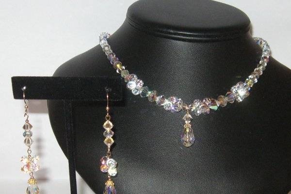 Swarovski all crystal necklace and earring set. In assorted newer shapes. The necklace is 19 inches long.
