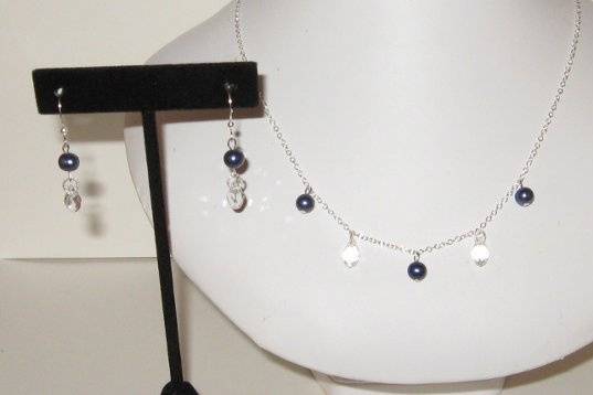 Fresh water pearls dyed a navy/royal shade.  Clear Swarovski crystals. Sterling Silver.