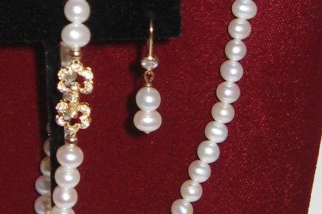 The necklace is 20 1/2 inch and the bracelet is a 8 1/2 inch.  The earrings have a 2 pearl drop we could add or take one away your choice. The fresh water pearls are a 6.5mm and potato in shape. They are grade 