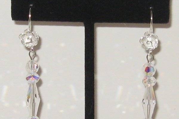 Sterling silver roses and all Swarovski crystal.