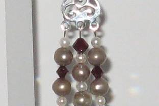 Taupe and cream shade of fresh water pearls.  Garnet shade of SWAROVSKI crystal.