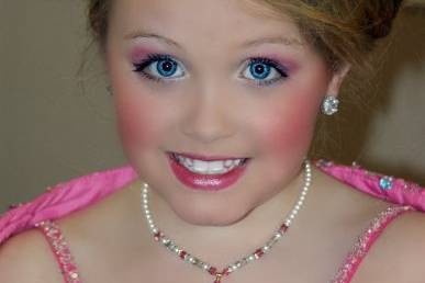 This little girl was a flower girl in her aunts wedding a couple of years earlier.  She still loves the necklace, and wears it.  Picture here is her after preforming in a local pageant.