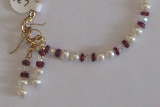 Rhodolite garnets micro faceted and fresh water pearls.  Great for that dark red wedding and after. Also a little SWAROVSKI crystal.