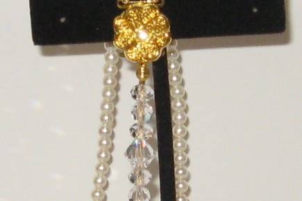 Two strands of SWAROVSKI pearls (the best in imitation pearls)with some crystal on one side for a dramatic effect.  Size 8 1/4