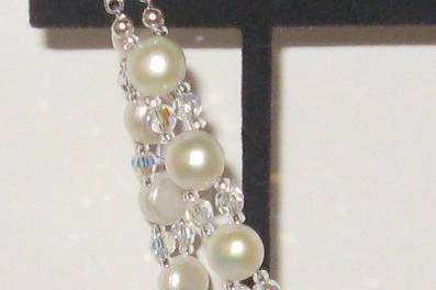 Beautiful button pearls in the 9 mm size with a little bit of SWAROVSKI crystal in the clear A.B. shade. Check out the sterling silver double safety clasp with a CZ in it.