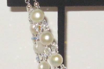 Button pearls with SWAROVSKI crystal. Sterling silver with a CZ and double safety clasps.