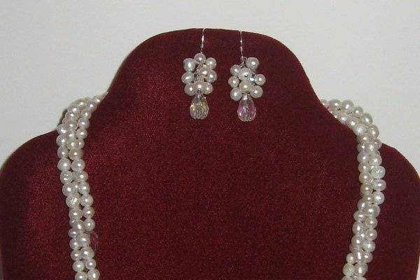 Close up of the earrings for the three strand necklace.