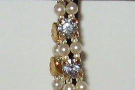 A bracelet full of BLING.  CZ's 6mm in size with SWAROVSKI cream pearls. 14kt gold filled clasps.  This can also be created in silver.