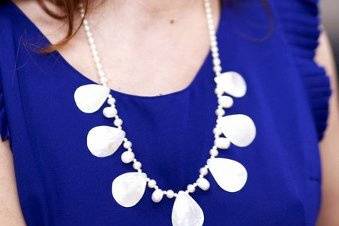 A perfect combo Mother of pearl tear drops, 9 mm rice pearls that are side drilled, and smaller pearls in between. This set has been done in sterling silver.  This is a 19 inch necklace and can be made shorter or longer.  I added a 5 inch extender for this shot to show off the tear drops on this pretty royal blue shade.