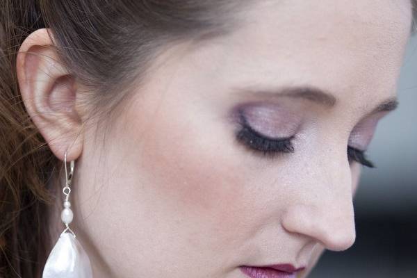 A close up of the mother of pearl earrings.  Sterling silver ear findings.