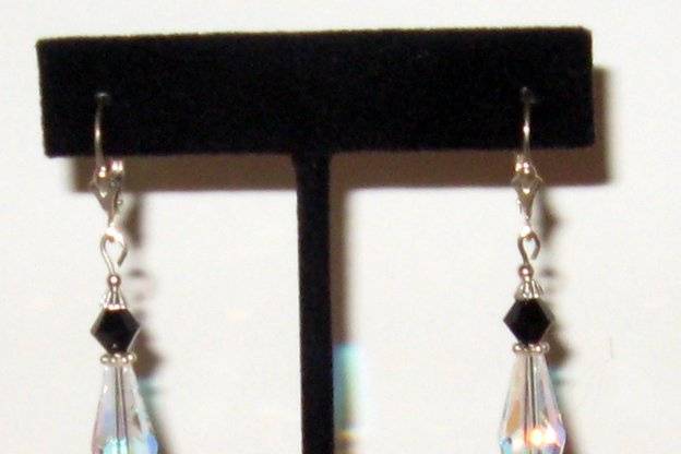 Elongated crystals with other shapes including black SWAROVSKI crystal.  Fancy sterling silver bead caps.  Mother of pearl drops make this the perfect black and white bridal earrings.