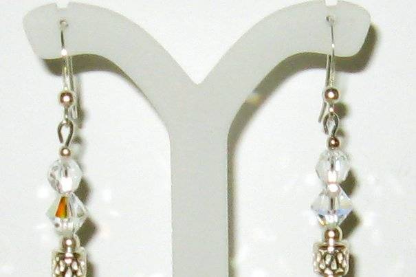 Long drops Swarovski crystal, sterling silver, and dyed fresh water pearls in purple.  Fun pair to wear.  These have a new home but can be recreated. I have enough of the purple pearls to make several pairs.
