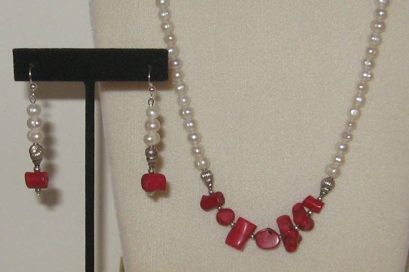 Fresh water pearls in the baroque shape.  Red corral and little sterling silver shells on the necklace and the earrings.  This set has also SOLD !  I do still have some of the silver shells.