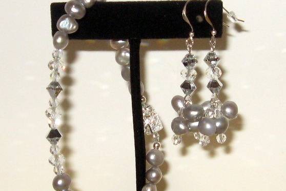 Baroque pearls in the silver shade with a new shade of Swarovski crystal. Sterling silver clasp and ear wires.