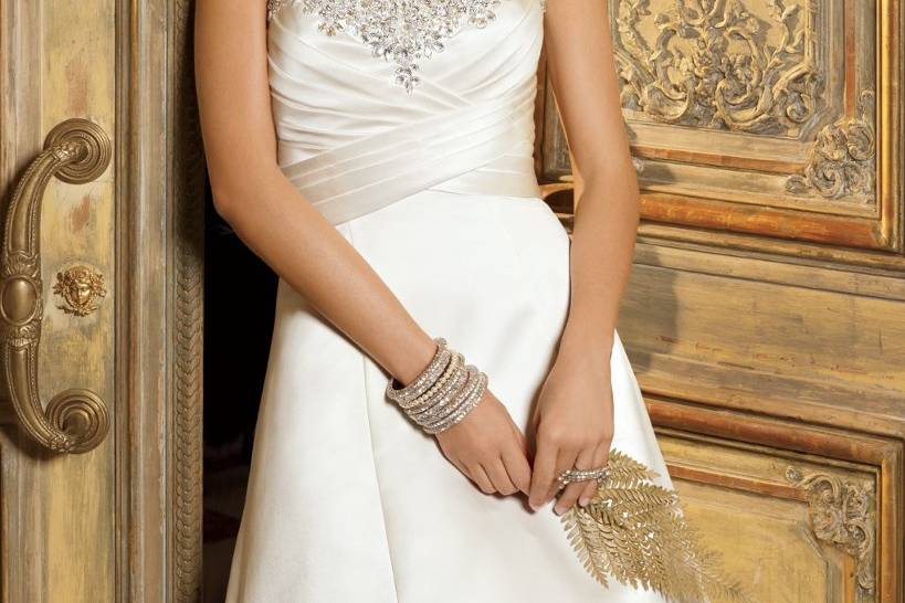 6031WStrapless soft satin a-line wedding dress with a shirred empire waist and heavy jeweled edging.
