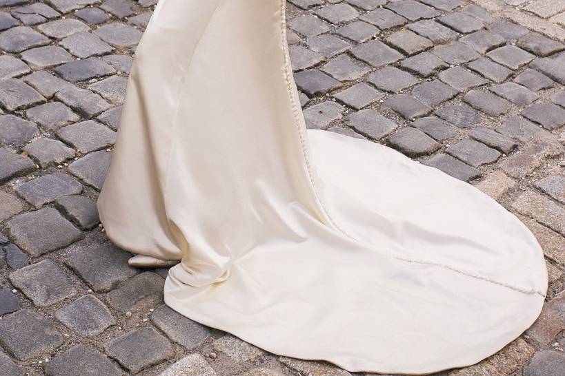 7051WStrapless soft shirred satin sheath wedding dress with button back and chapel length train.