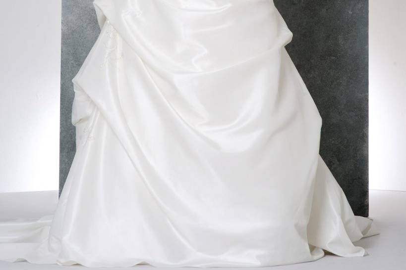 41770-SON9010This elegant taffeta plus size wedding dress is beautifully crafted with a beaded top and side draping.