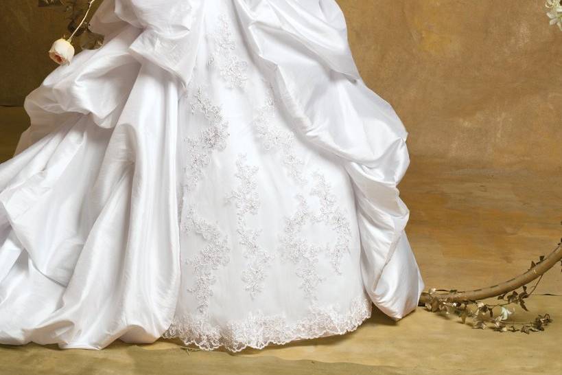 6180WStrapless taffeta wedding dress with beaded lace instet, beaded and shirred bodice, and a gathered cathedral train modestly adorned with flower rosettes.