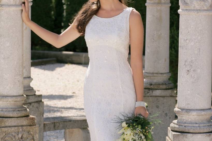 2157WFully beaded and lace wedding dress with scoop neck, empire waist, princess seams, and a chapel length train.
