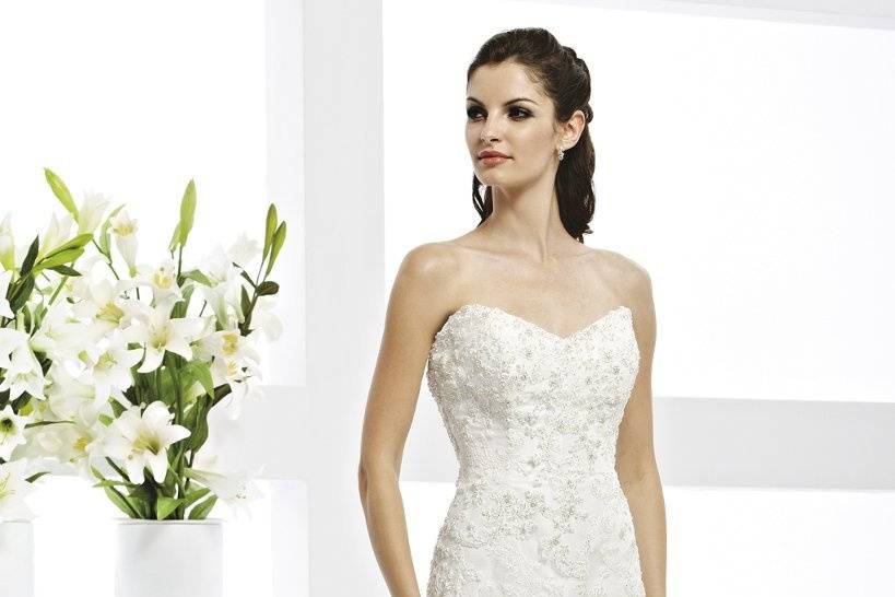 41770-VR61059This strapless wedding dress eludes elegance with beaded lace appliques and a sweeping cathedral train.