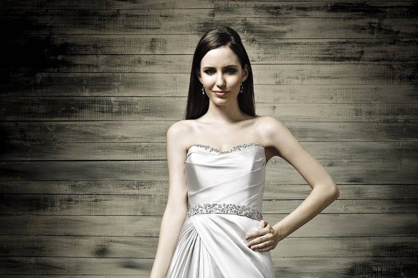 41770-D31065This beautiful satin wedding dress has detailed beading at the top of the bodice and waistline.