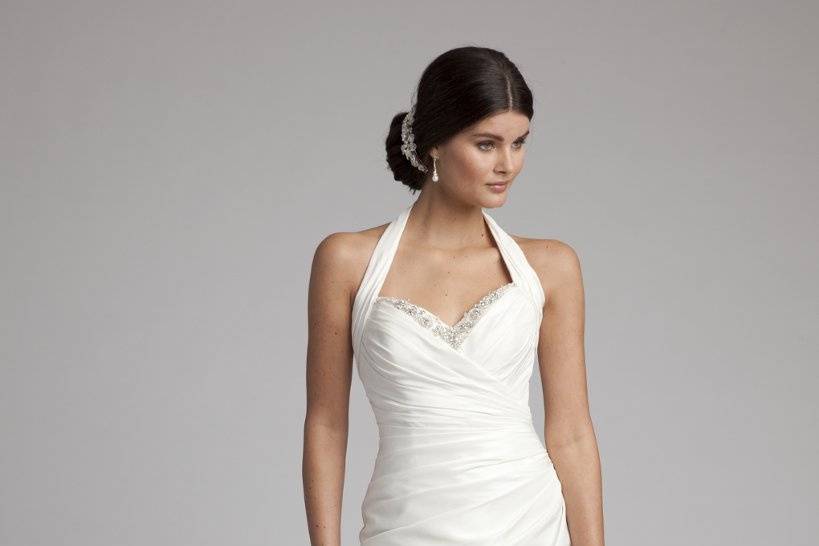 Style No. 41770_8292W <br>Classic sophistication and beauty emanates throughout this gorgeous halter wedding gown that's made for a bridal starlet. The clean lines and timeless silhouette will complement many figures, making for a truly stunning look that simply never goes out of style. Beautiful qualities include beading along the top edge and bottom back with luxe taffeta from head to toe.