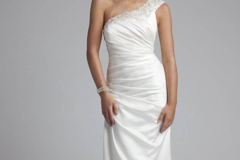 Style No. 42426-1388W <br>Luxurious elements of this dress include a beaded one shoulder detail and a lovely ruched bodice that is comprised in plush satin. For finishing touches, this dress comes in a gorgeous chapel train.