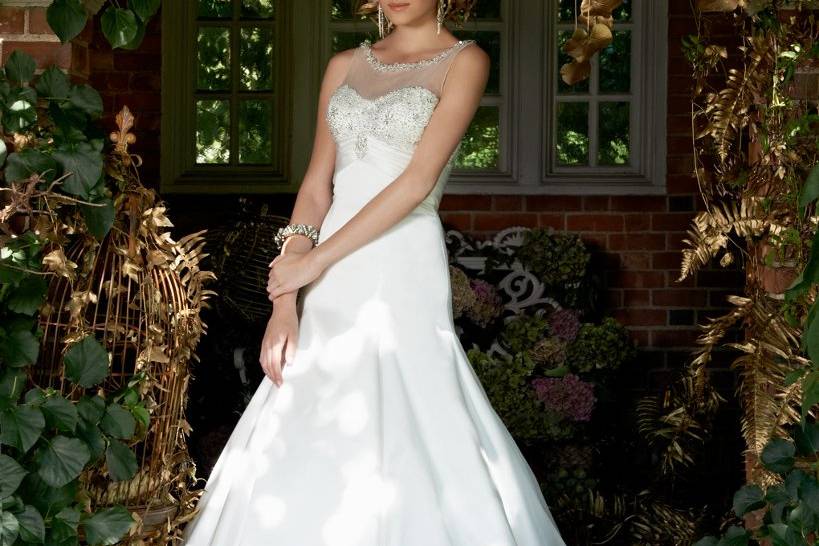 Style No. 43424_1439W <br>Stunning elements that you'll truly treasure about this dress include its timeless A-line skirt with beaded illusion neckline that follows down into a lovely beaded bodice with buttons that run down the back and ending down at the hemline. And the beautiful features do not stop there. For added drama you'll love the glorious chapel train.