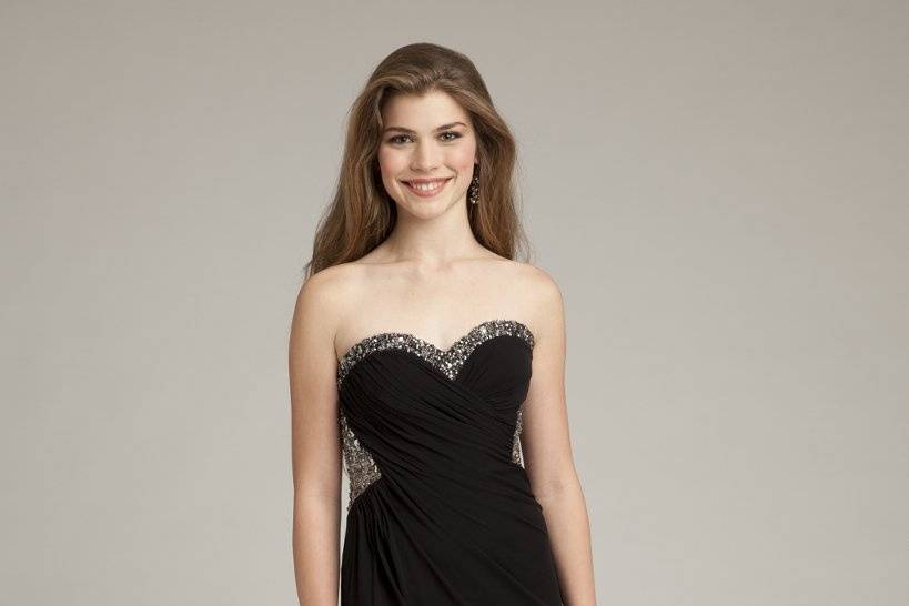 Style No. 24252_18803 <br>The sweetheart neckline and strapless bodice are charming features. Dazzling beading along the empire bodice glamorize this solid color dress, while soft cascading chiffon is draped to shape a dramatic slit-front to show off some skin and ensure fabulous movement while you dance the night away!