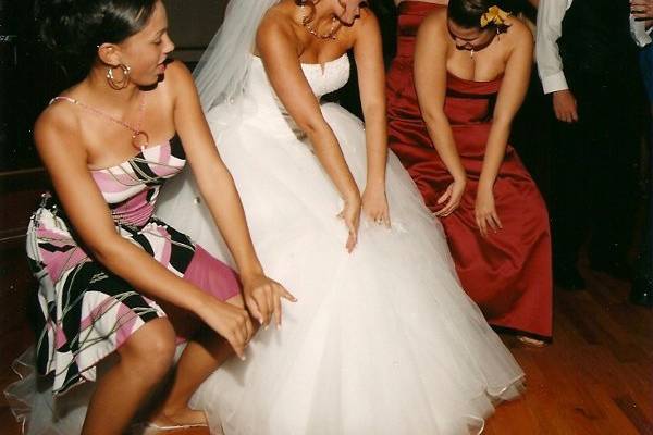 The bride dancing with her bridesmaids