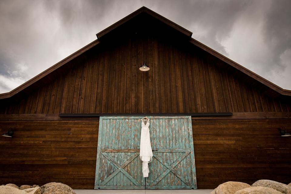 Dress hanging on barn doors