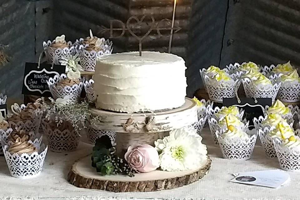 Wedding cake and cupcakes