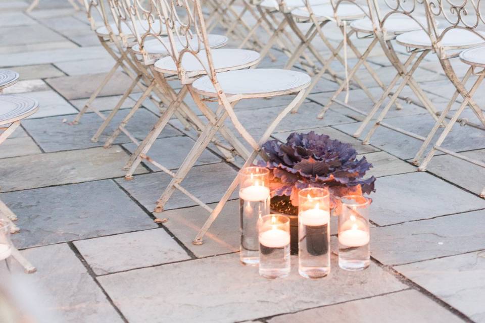 Candle lights and floral aisle marker