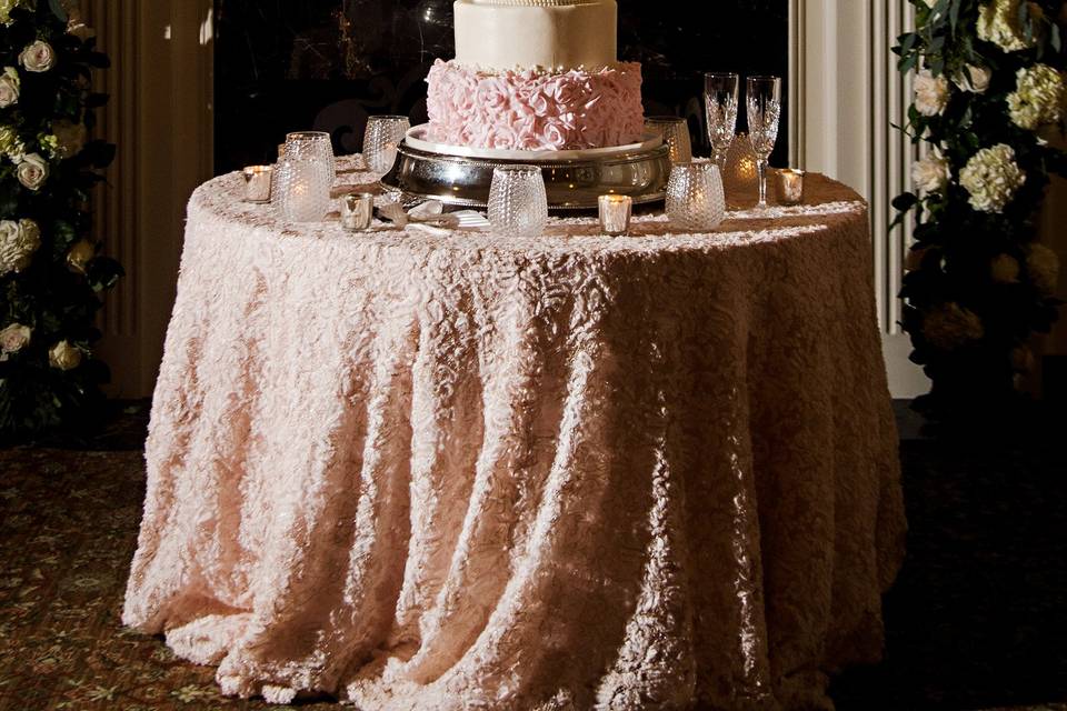 Dramatic mantel design behind the wedding cake | Photo Credit: Pure Sugar Studios