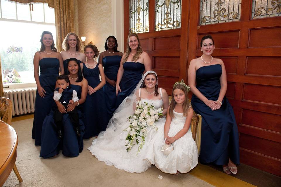 Bride with flower girl and bridesmaids