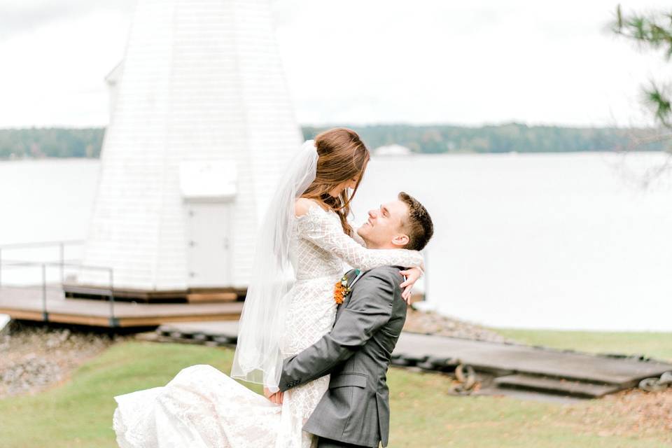 Groom carrying his bride