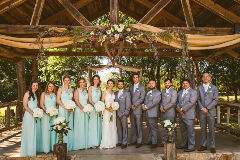 The couple with the bridesmaids and groomsmen