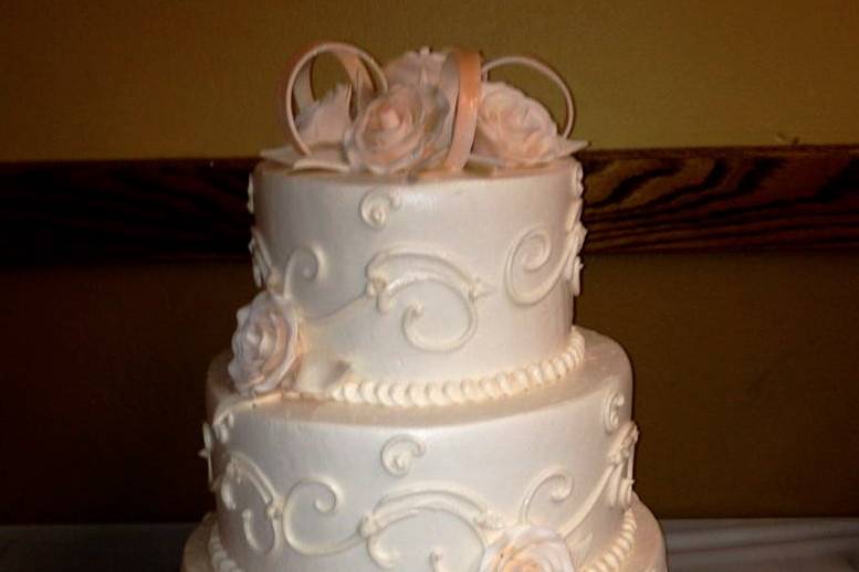 Traditional ivory on ivory wedding cake