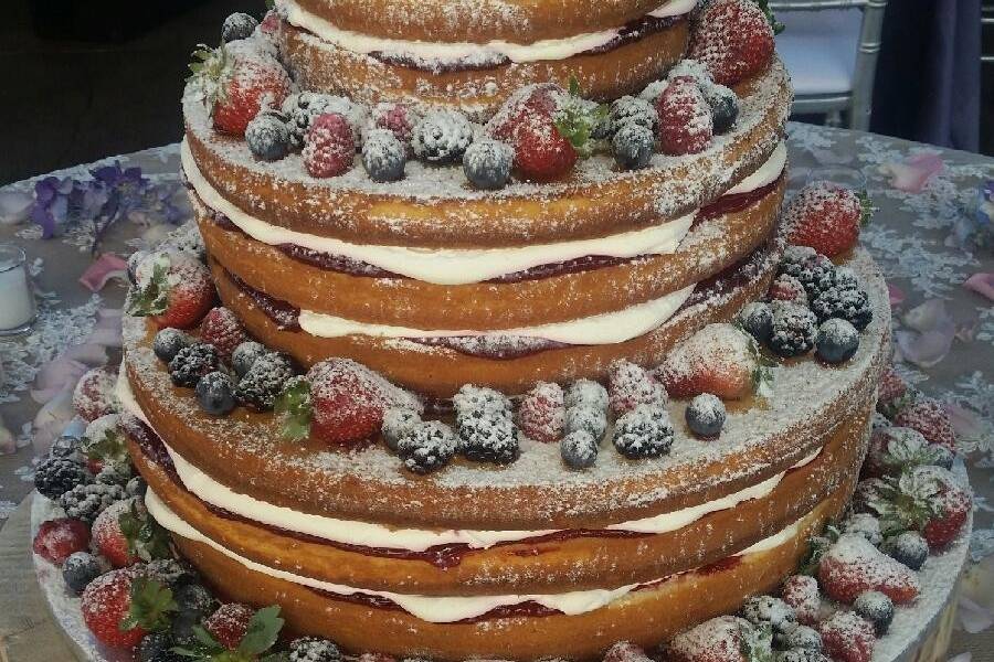 Naked wedding cake with fresh fruits