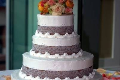 Cake with floral cake topper.