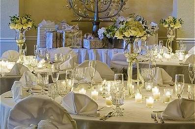 Grand ballroom done in white decor for wedding.