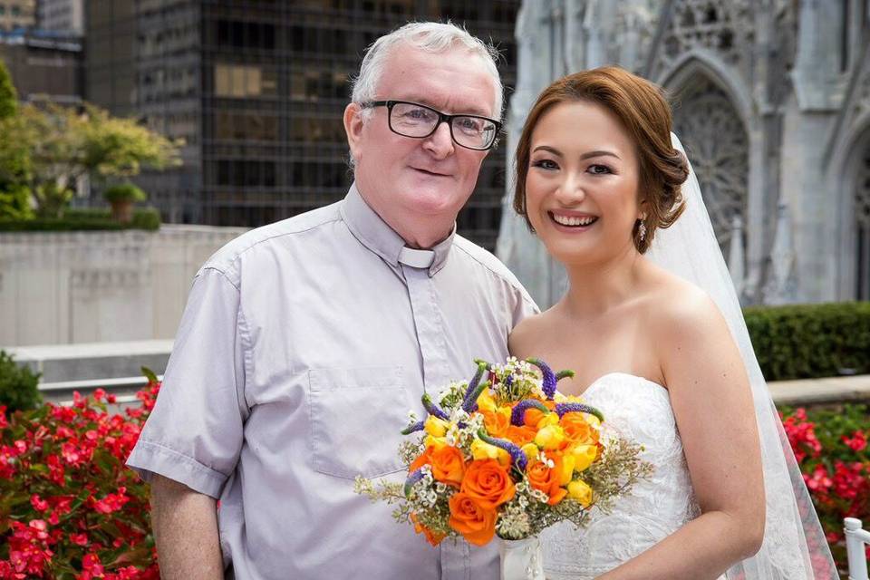 The bride with Fr. Noel
