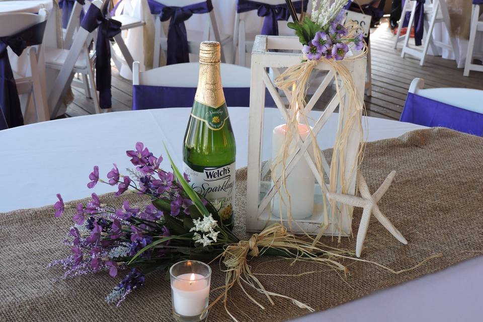 Going coastal with burlap runners and white lanterns.