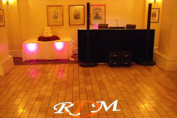Wedding reception with small uplighting and monogram projection.