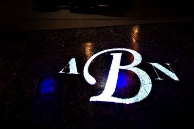 Wedding reception with basic lighting and monogram projection