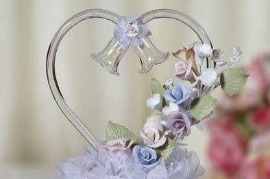 This beautiful cake topper features pastel colored handmade porcelain roses with an artisan made glass heart and wedding bells. Skirt is made of organza.
SKU: 100259
$48.95
http://www.weddingcollectibles.com/PastelPorcelainRoseCakeTopper.html