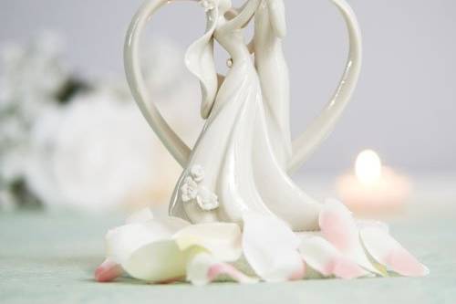 This Stylized Bride and Groom with Heart Frame Figurine is a contemporary twist on a traditional element. Picture this, a stylized couple dancing within a heart frame topping your wedding cake. This cake top will add a unique elegant touch to your wedding and a memento for years to come.
SKU: 707515
$29.95
http://www.weddingcollectibles.com/Stylized-Bride-and-Groom-with-Heart-Frame-Figurine-p-154.html