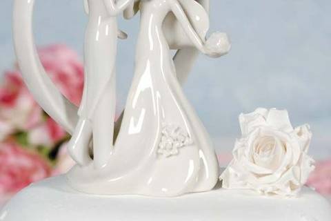 This elegant white porcelain heart with Groom holding Bride's hand cake top figurine is the perfect item to top your cake! This item can also be used as the finishing touch to decorate your sign in guest book table! Set the tone of your wedding the minute the guests arrive. Perfect for a heart themed wedding!
SKU: 707516
$24.95
http://www.weddingcollectibles.com/Heart-with-Groom-Holding-Brides-Hand-p-155.html